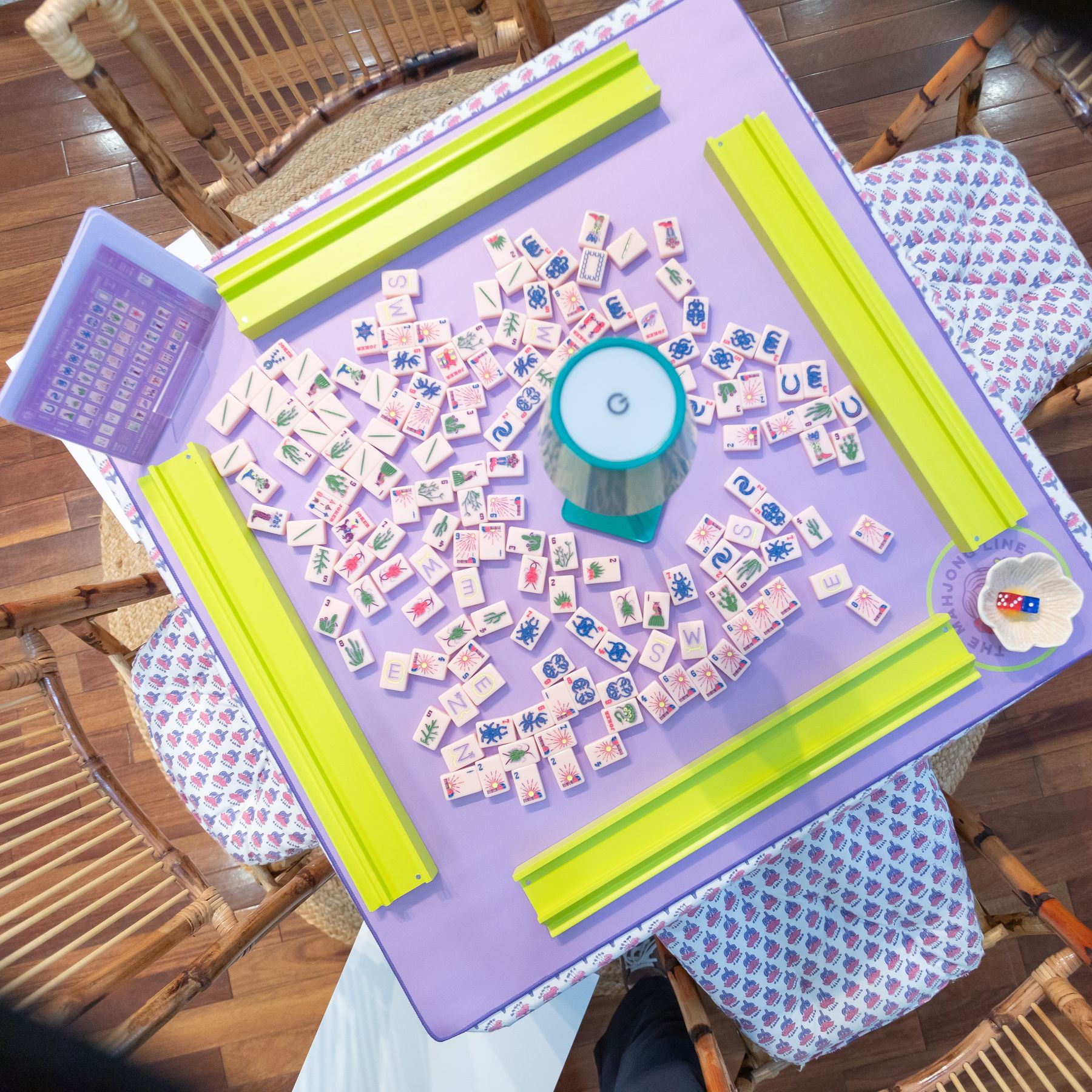 A studio table set with tiles and racks